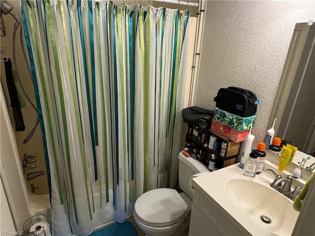 full bathroom featuring vanity, shower / bath combo, and toilet