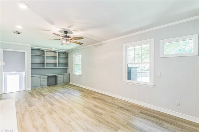 unfurnished living room featuring ceiling fan, light wood-type flooring, ornamental molding, and baseboards