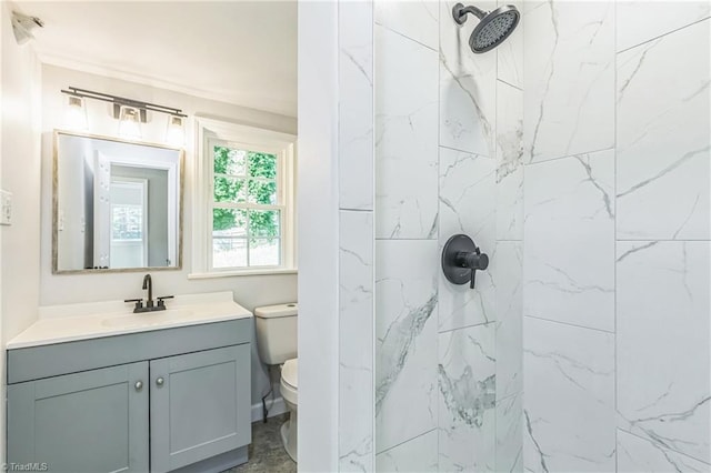 full bathroom featuring a marble finish shower, vanity, and toilet