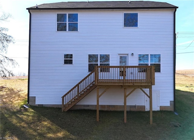 rear view of house with a wooden deck