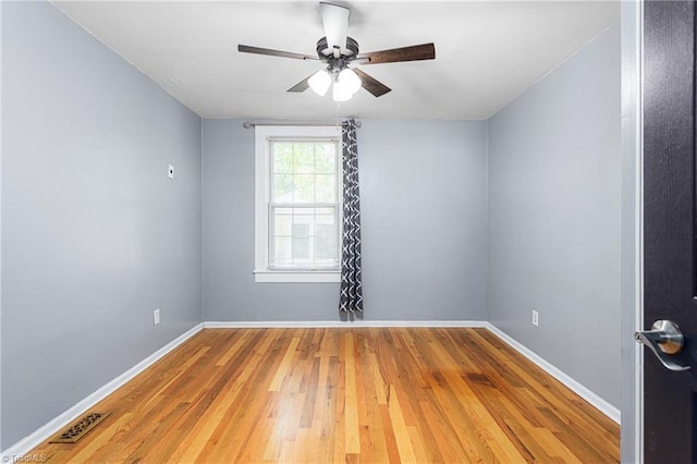 307 W Austin St, Mebane, NC 27302 - unfurnished room with wood finished floors, ceiling fan, and baseboards