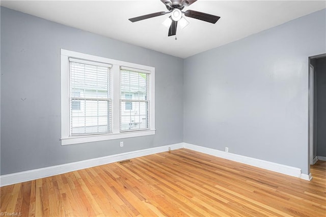 307 W Austin St, Mebane, NC 27302 - spare room with light wood-style floors, baseboards, and a ceiling fan