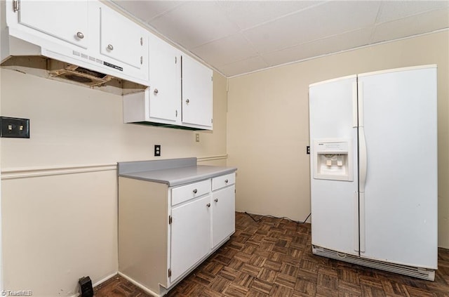 kitchen featuring white fridge with ice dispenser, white cabinets, and dark parquet floors