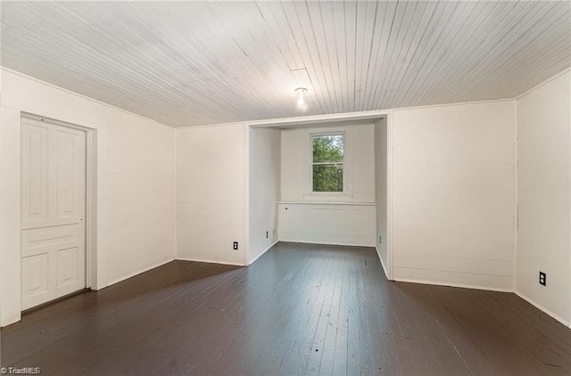 unfurnished room featuring dark hardwood / wood-style flooring