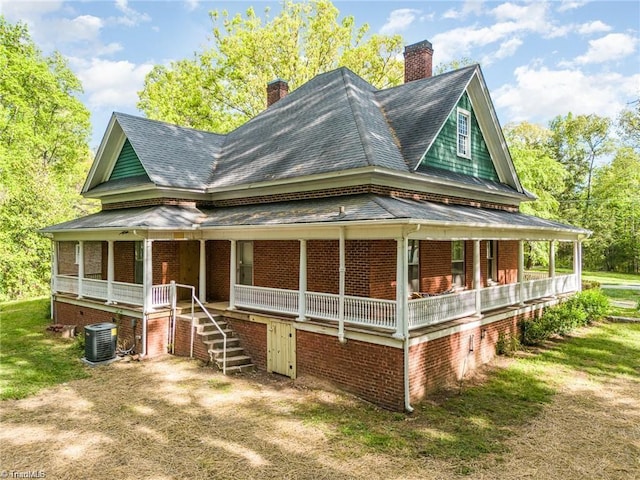 view of front facade with covered porch and central air condition unit