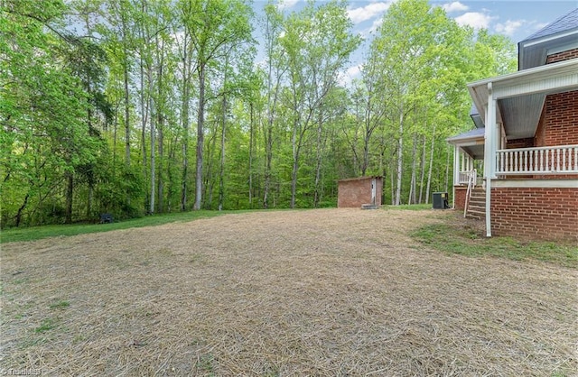 view of yard featuring central air condition unit