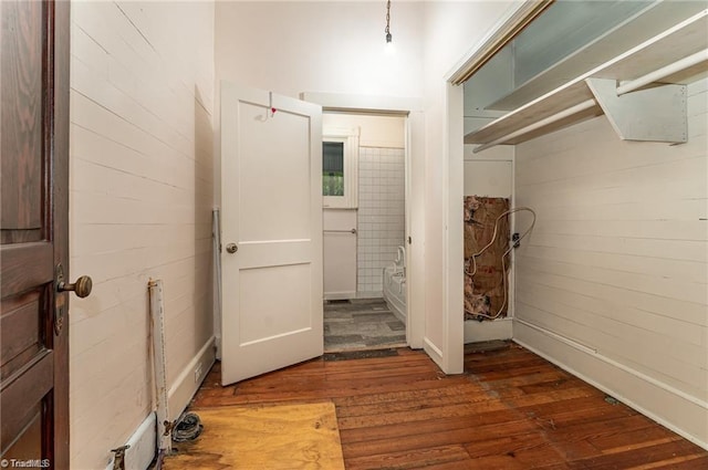 corridor featuring dark hardwood / wood-style flooring