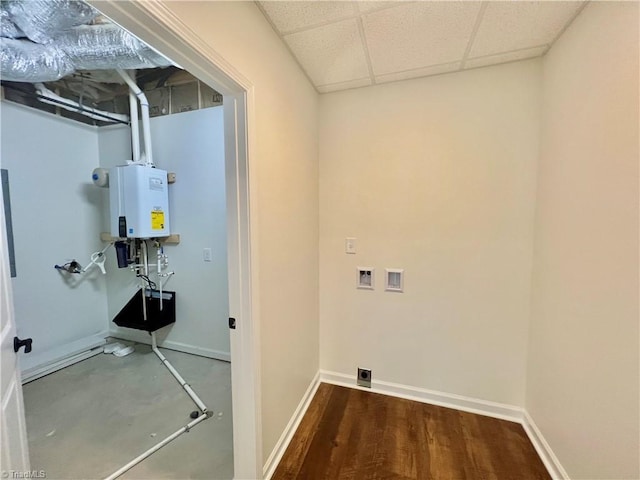 laundry room with dark hardwood / wood-style floors, hookup for a washing machine, and water heater