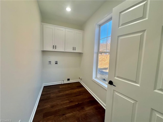 clothes washing area with dark hardwood / wood-style flooring, hookup for a gas dryer, hookup for a washing machine, and cabinets