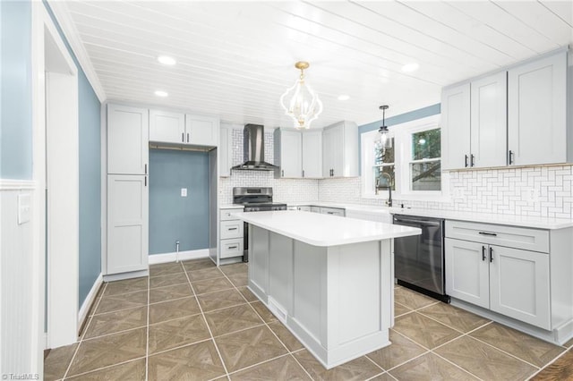 kitchen featuring a sink, stainless steel appliances, wall chimney range hood, and tile patterned flooring