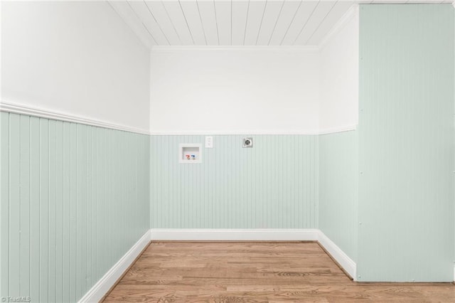 laundry room with laundry area, wood finished floors, hookup for a washing machine, crown molding, and hookup for an electric dryer