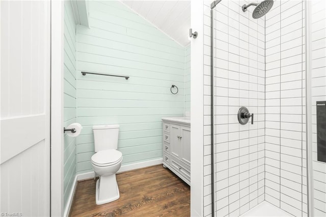 bathroom featuring vanity, wood finished floors, a shower stall, and toilet