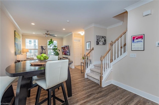 dining area with stairs, crown molding, and dark wood-style flooring