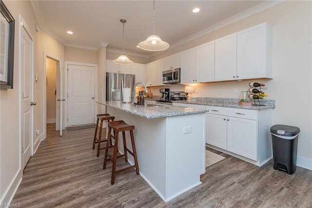 kitchen featuring white cabinets, dark wood-style flooring, and appliances with stainless steel finishes