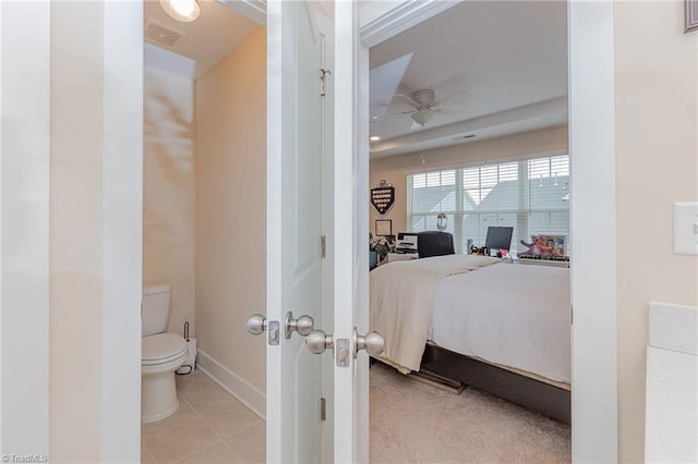 bedroom with light tile patterned floors, visible vents, and baseboards