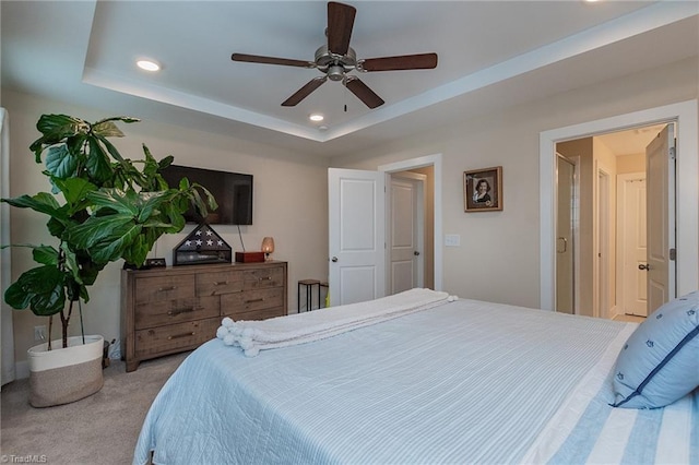 bedroom featuring recessed lighting, a raised ceiling, and carpet flooring