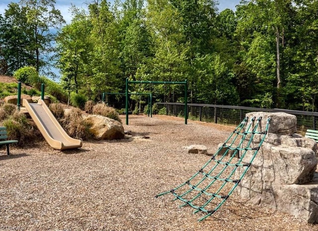 view of community with fence and playground community