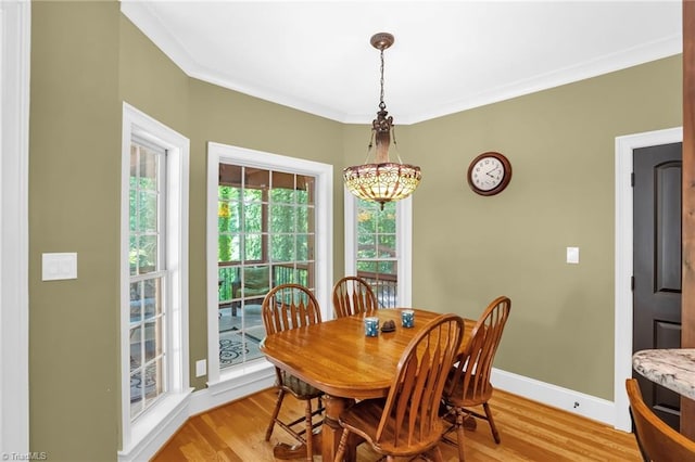 7821 Charles Place Dr, Kernersville, NC 27284 - dining space with light wood-type flooring and crown molding