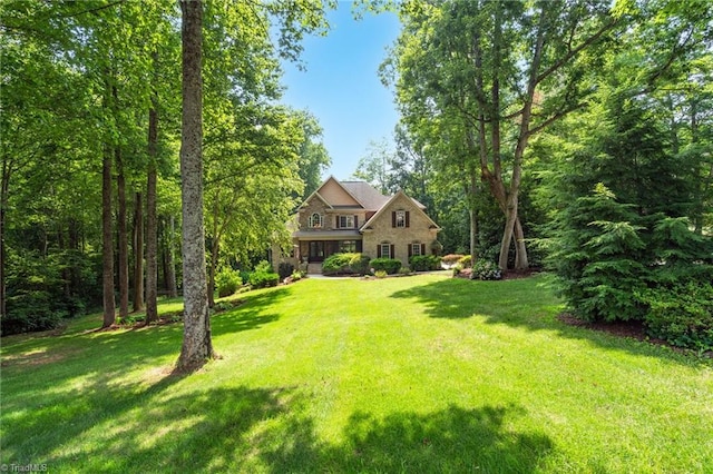 7821 Charles Place Dr, Kernersville, NC 27284 - view of front facade featuring a front yard