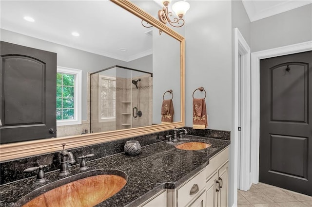7821 Charles Place Dr, Kernersville, NC 27284 - full bathroom with a stall shower, double vanity, tile patterned floors, and ornamental molding
