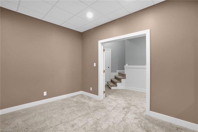 7821 Charles Place Dr, Kernersville, NC 27284 - carpeted spare room with a paneled ceiling and stairs