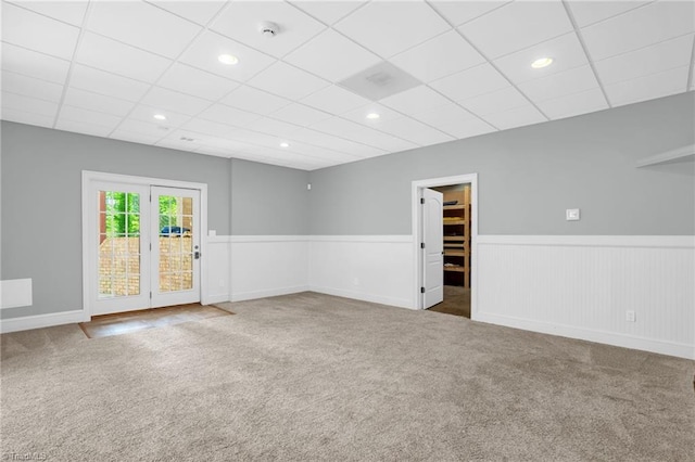 7821 Charles Place Dr, Kernersville, NC 27284 - unfurnished room featuring carpet floors, a smoke detector, a wainscoted wall, a paneled ceiling, and recessed lighting