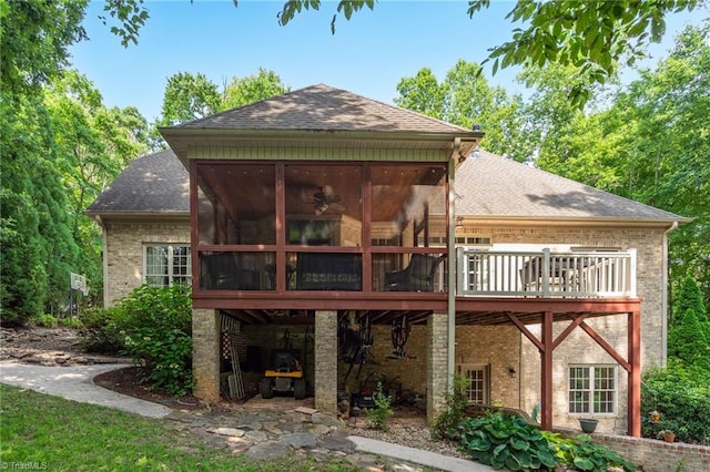 7821 Charles Place Dr, Kernersville, NC 27284 - back of house featuring roof with shingles, a sunroom, and brick siding