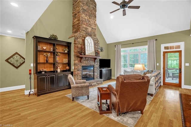 7821 Charles Place Dr, Kernersville, NC 27284 - living area with high vaulted ceiling, ceiling fan, light wood-type flooring, a fireplace, and recessed lighting