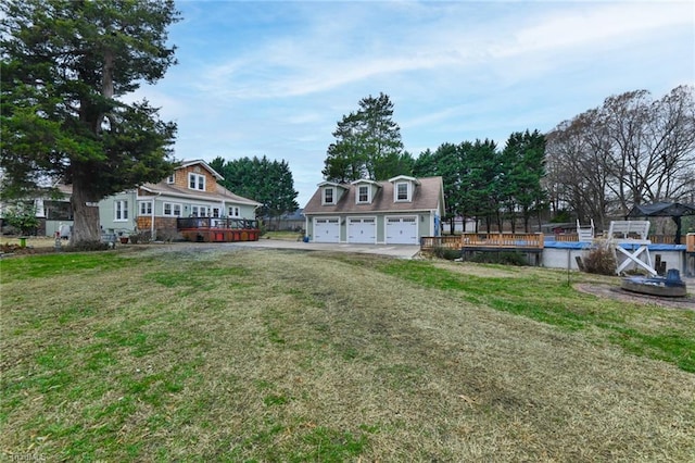 view of yard featuring a garage