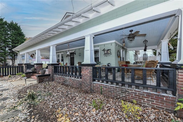 view of patio featuring ceiling fan and a porch