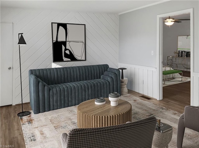 living room with light hardwood / wood-style floors and ceiling fan