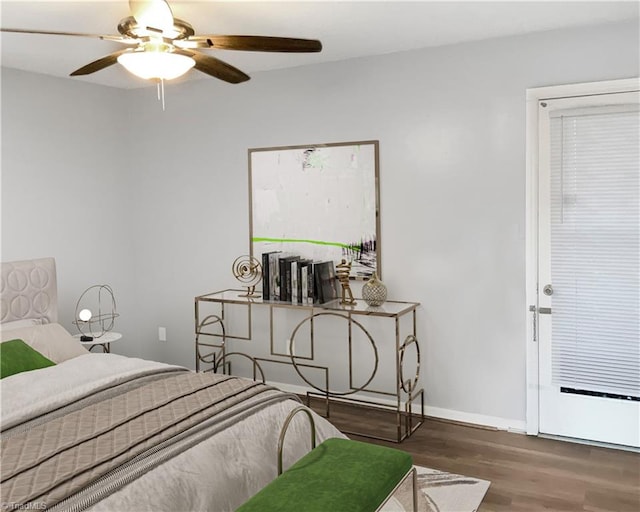 bedroom with ceiling fan and dark hardwood / wood-style floors