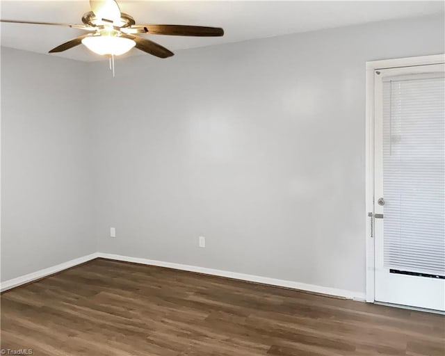 unfurnished room featuring dark hardwood / wood-style flooring and ceiling fan