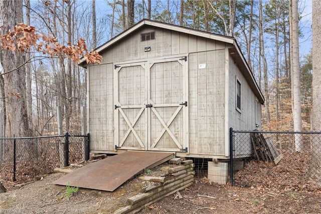 view of shed with fence