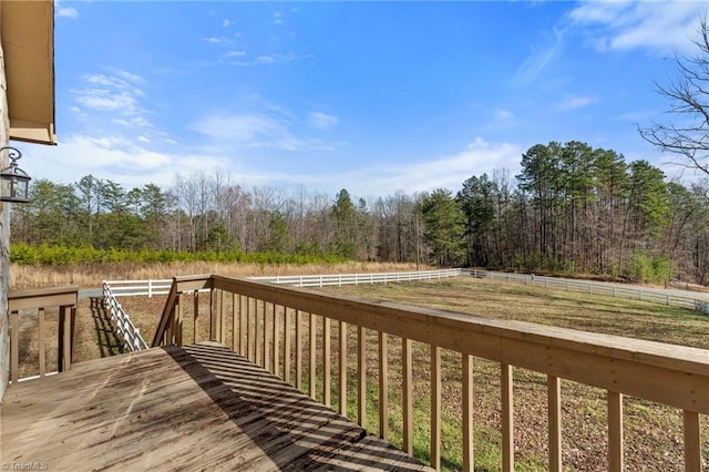 wooden terrace with a view of trees