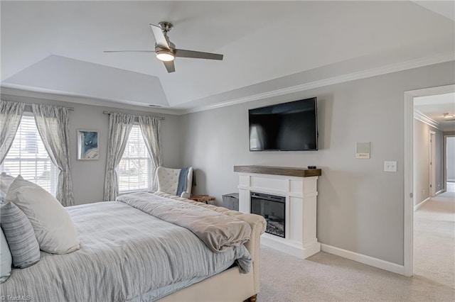 bedroom featuring a raised ceiling, crown molding, carpet, and baseboards