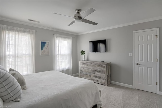 bedroom with visible vents, ceiling fan, baseboards, ornamental molding, and carpet flooring