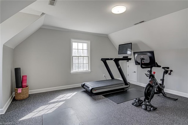 exercise room featuring visible vents, baseboards, and vaulted ceiling