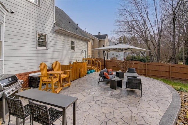 view of patio / terrace featuring an outdoor hangout area, a grill, outdoor dining space, and fence