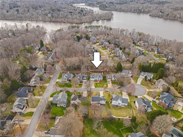 birds eye view of property featuring a residential view and a water view