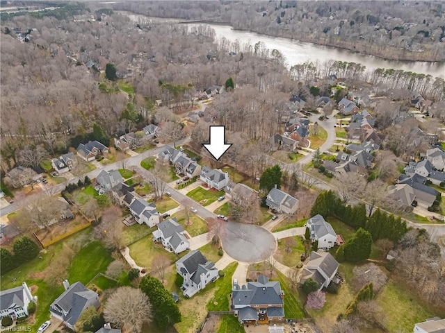 drone / aerial view featuring a residential view and a water view