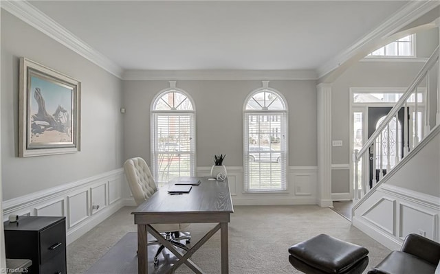 office area featuring wainscoting, light colored carpet, and ornamental molding