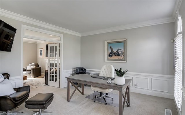 office area featuring visible vents, light carpet, ornamental molding, and wainscoting