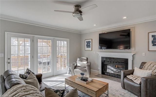 carpeted living room with a fireplace with flush hearth, ornamental molding, recessed lighting, baseboards, and ceiling fan