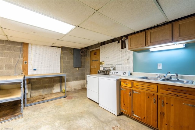 clothes washing area featuring cabinets, separate washer and dryer, sink, and electric panel