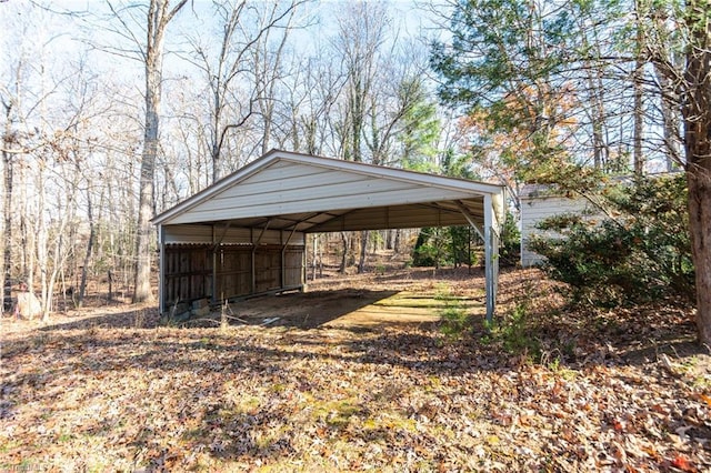 view of outbuilding with a carport