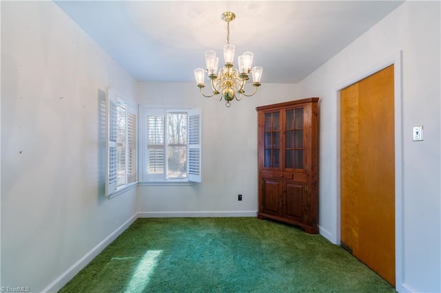 unfurnished room featuring dark carpet and an inviting chandelier