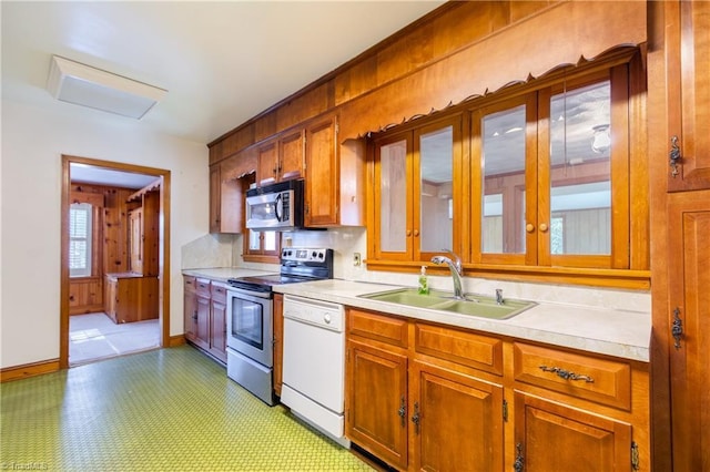 kitchen featuring decorative backsplash, sink, and stainless steel appliances