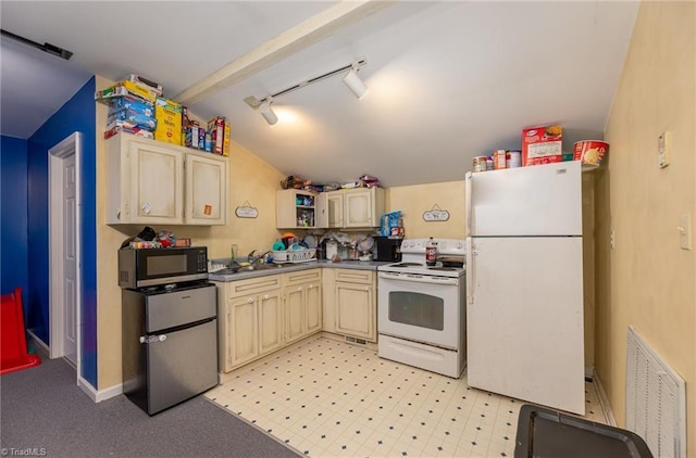 1414 Henri St, Mount Airy, NC 27030 - kitchen featuring white appliances, lofted ceiling, track lighting, a sink, and cream cabinetry