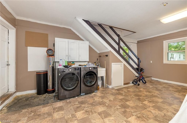 1414 Henri St, Mount Airy, NC 27030 - laundry room with separate washer and dryer, cabinet space, stone finish floors, baseboards, and ornamental molding